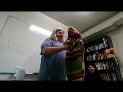 Receiving a Fourth Doctor Scarf from a Student