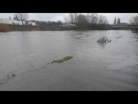 River Aire flooding by Citu Bridge near Aire Park in Leeds City Centre due to Storm Darcy