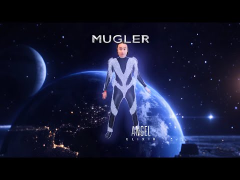 Mugler's cosmic crystal warriors, adorned in starry blues, embody a trans-dimensional fashion ode.