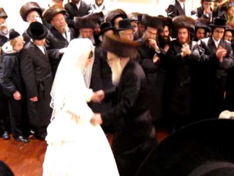 Rabbi Katz Dancing with his Granddaughter
