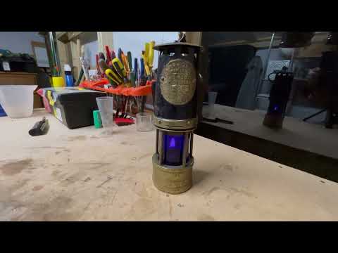 Hailwood & Ackroyd miners lamp with coloured glasses.