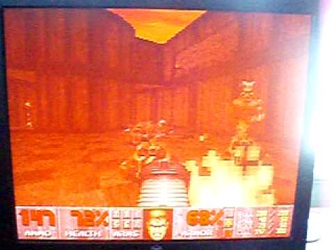 Baron of Hell kills Spider Mastermind in Ultimate Doom