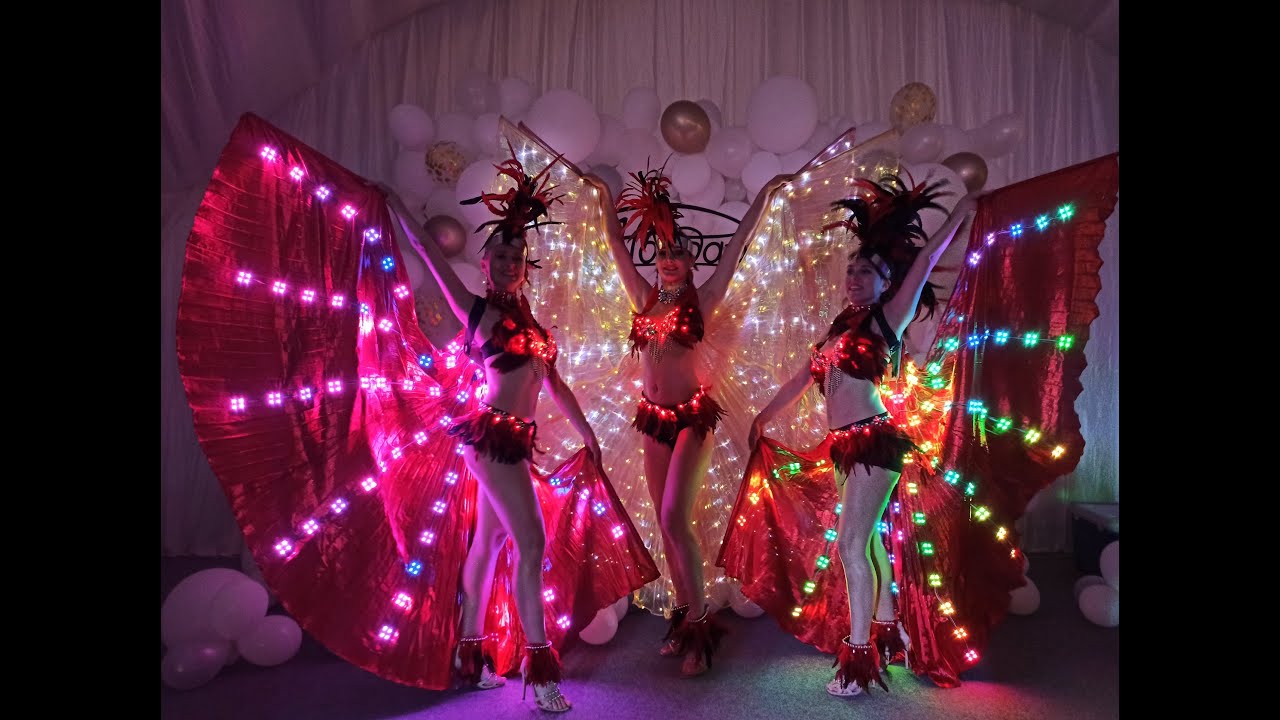 Brazilian-style dance performance with illuminated LED wings for events in Dubai by ILLIZIUM