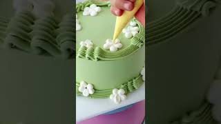 Download the video "Green Ruffle Cake with White Flowers Toppings| Love"