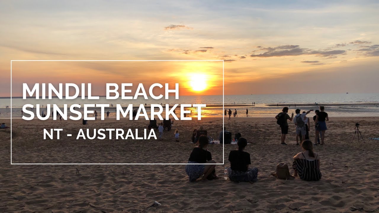 Watch the sun go down as people eat, shop, and relax on Mindil Beach.
