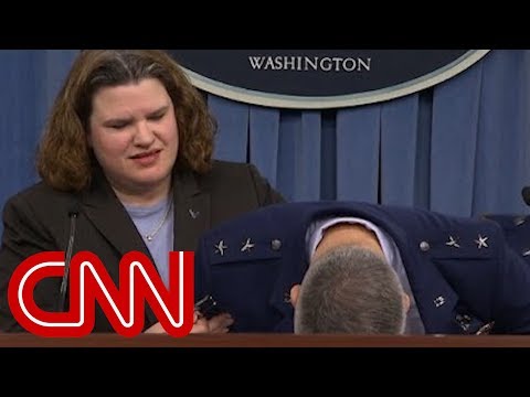 Major general faints during news conference