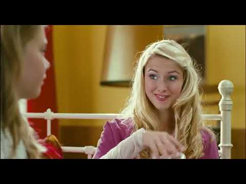 Trailer frame — close-up of Julia at the mic, lights flaring behind, crowd hands up