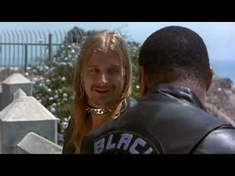 Close-up of spinning rear wheel and tire smoke as starter drops the flag