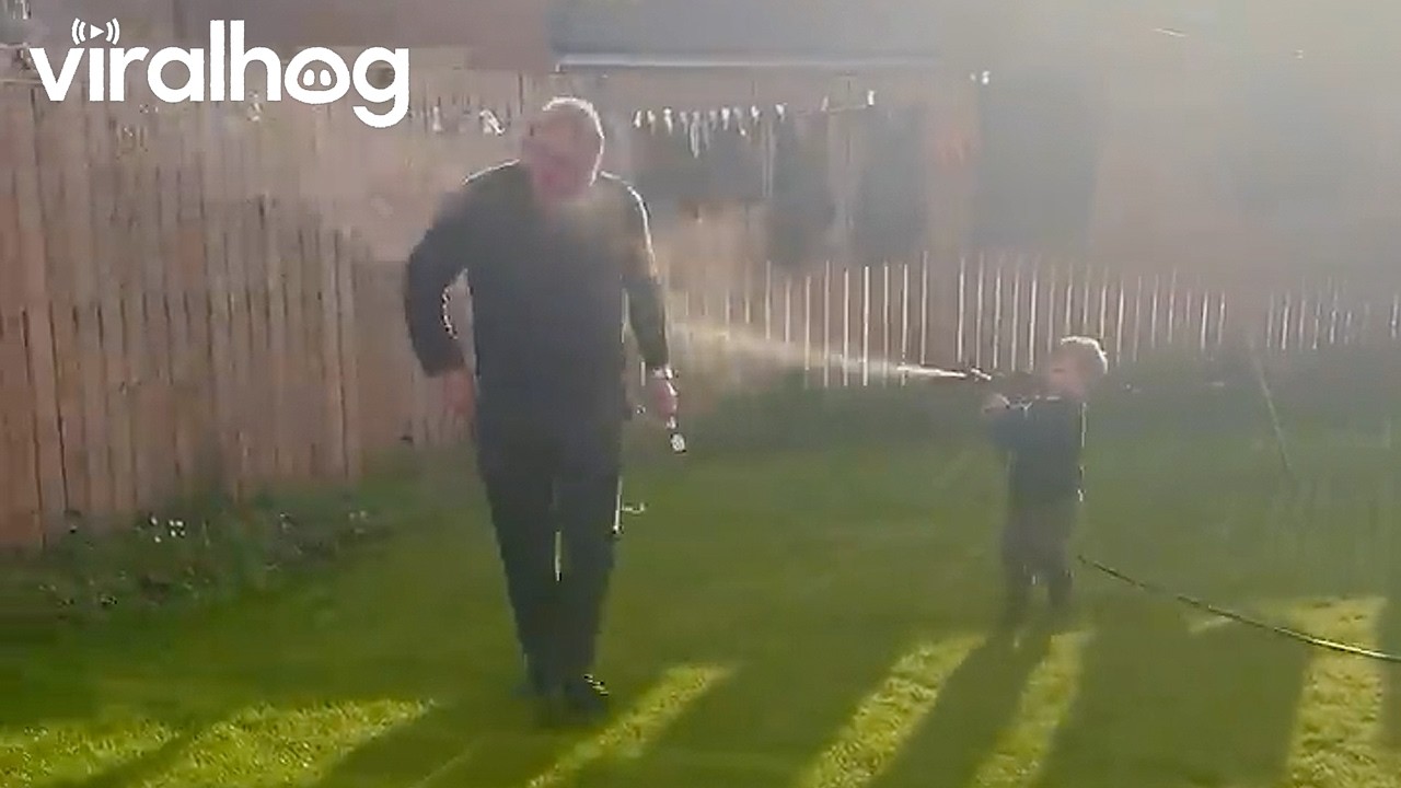 Toddler ‘Watering’ Grandad With the Hose || ViralHog