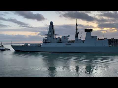 HMS Defender - dusk departure from Portsmouth