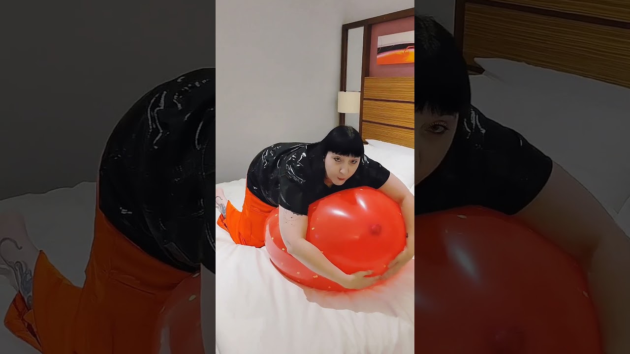 Deflating giant cattex strawberry balloon from Balloon Ace