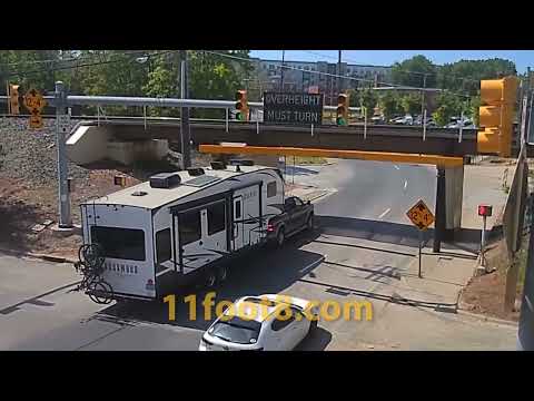 Camper trailer loses equipment at the 11foot8+8 bridge
