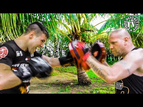 Boxing pad work drills under palm trees with Coach Ralf Stege