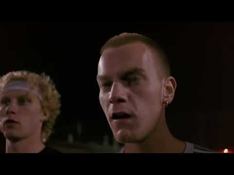 Trainspotting 1996 official trailer frame: Renton and Spud sprint down Princes Street as the soundtrack snaps into gear