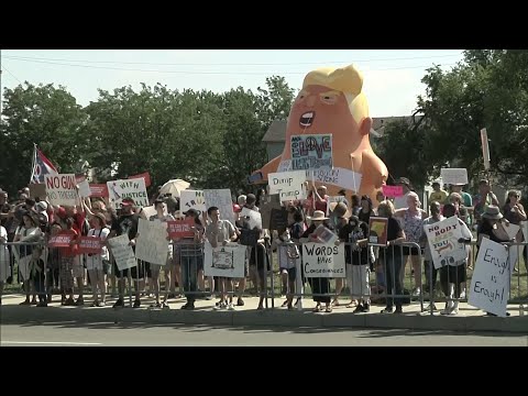 At least 200 protesters gathered outside Miami Valley Hospital in Dayton, Ohio Wednesday, hoping to send a message to President Donald Trump that he's not welcome in the city. A bar shooting left nine dead and dozens injured over the weekend. (August 7)