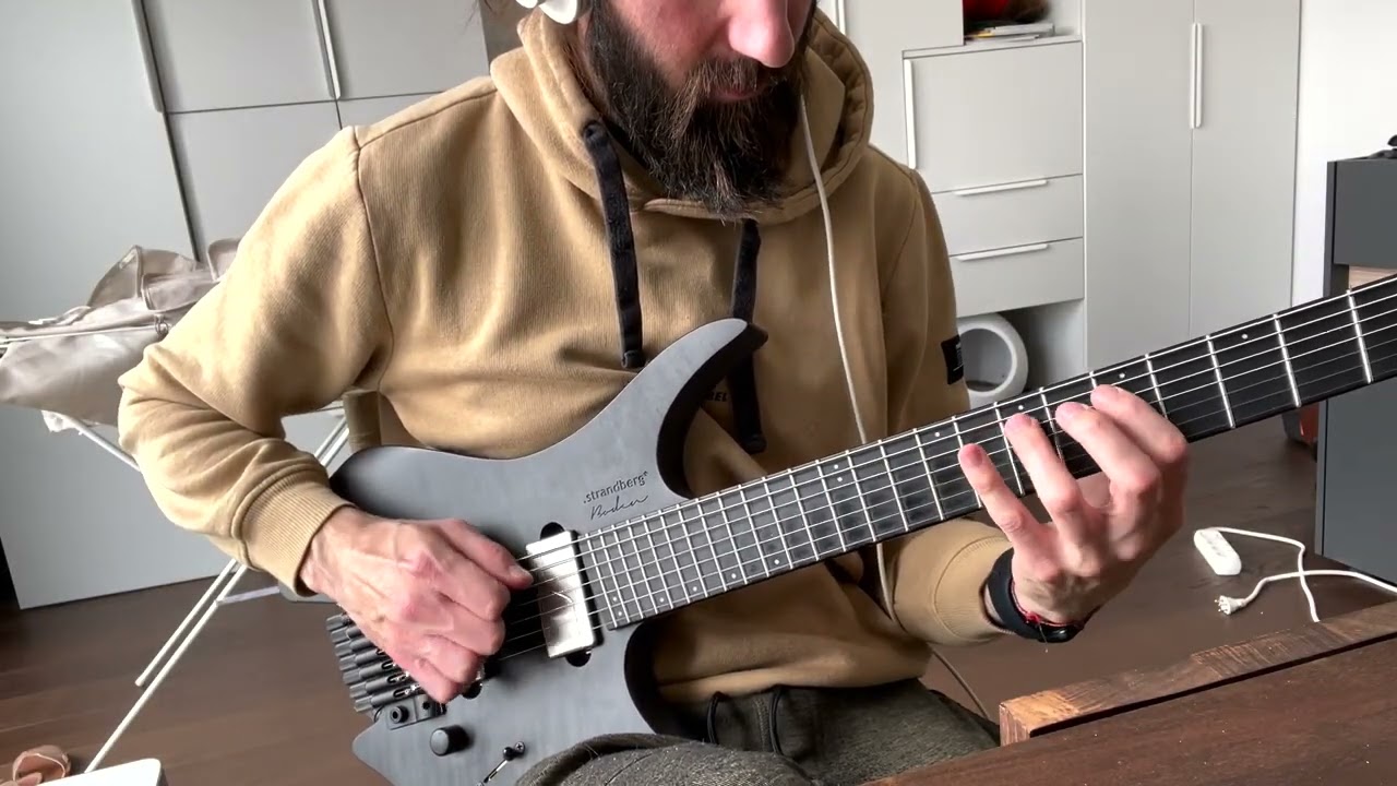 Guitarist demonstrating a slow-fast speed burst picking exercise on electric guitar