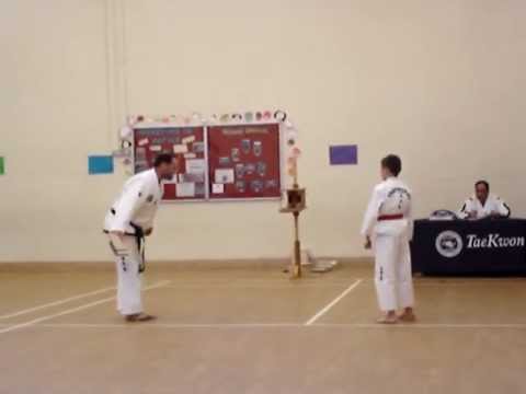 Black belt grading taekwondo Kacper breaking boards