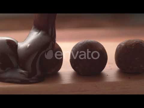 Chocolate pouring onto truffles in super slow motion. Shot on Phantom Flex 4K high speed camera....