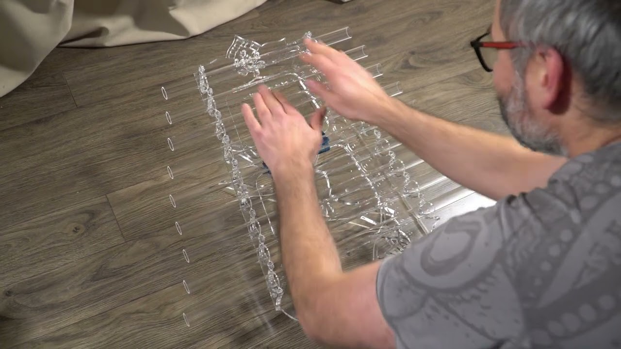 Wet hands play the crystal harp