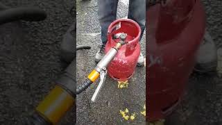 How to fill a propane gas bottle with an adaptor at a LPG filling station