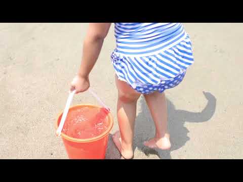 kids for the first time in the beach