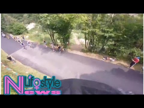 Stunt cyclist jumps over Tour de France participants