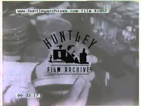 Chemist examines a sample, 1940's - Film 41857