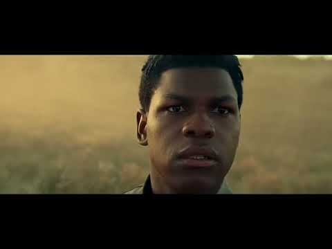 Trailer still: Rey on the Death Star wreck, wind and waves rising under a tense motif