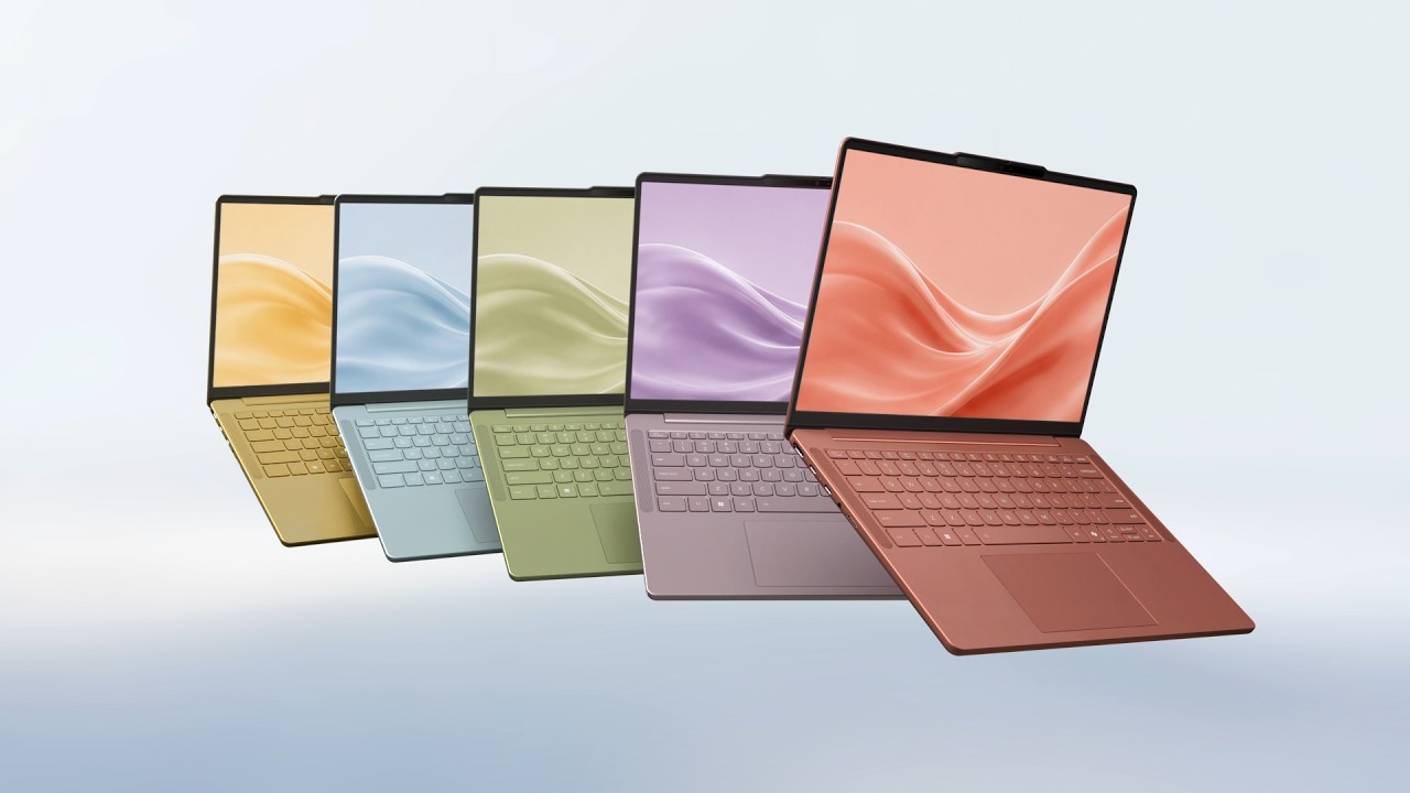 Cinq couleurs différentes de portables Lenovo IdeaPad Vibe émergent de tourbillons de peinture dans leur coloris respectif : Corail radieux, Bleu givré, Vert zen, Violet onirique et Or épicé.