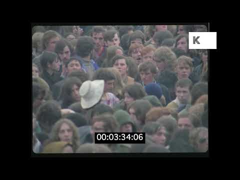 1960s, 1970s Outdoor Hippie Festival Crowd Rushes from 35mm