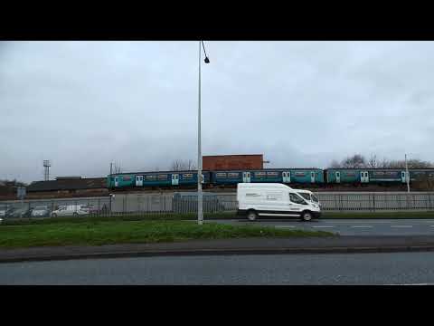 Prestatyn bound Transport for Wales train heads west out of Flint Flintshire UK 11.12.20