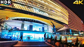 With Travel East . . . With China Walking Tour . . . Wuhan Dream Times Square Visitor Guide Introduction Wuhan Dream Times Square is a vibrant commercial and entertainment hub located in the heart of Wuhan. With its modern architecture, diverse shopping options, trendy dining venues, and exciting entertainment choices, Dream Times Square is a must-visit destination for locals and tourists alike. This guide will provide you with all the information you need to make the most of your visit to this dynamic area. Key Attractions 1. Shopping Paradise Dream Times Square is home to a vast array of shops, ranging from high-end luxury brands to affordable fashion outlets. Whether you`re looking for the latest fashion trends, electronics, or unique gifts, you`ll find something that suits your taste and budget. Some popular stores include: Gucci and Louis Vuitton: For those interested in luxury fashion, these flagship stores offer the latest in high-end apparel and accessories. UNIQLO and H&M: These well-known brands offer trendy and affordable clothing options for all ages. Local Boutiques: Discover unique fashion pieces and accessories from local designers in various boutiques throughout the square. 2. Entertainment Options Dream Times Square is more than just a shopping destination. It offers a variety of entertainment options for visitors of all ages, making it a perfect spot for a day out. Cinema Complex: Catch the latest blockbuster movies in state-of-the-art theaters with comfortable seating and high-quality sound systems. VR Experience Centers: Engage in immersive virtual reality experiences, from adventure games to futuristic simulations. Karaoke Bars: Unleash your inner pop star at one of the many karaoke bars, a popular activity for groups of friends and families. Dining Options Dream Times Square offers a diverse range of dining options to satisfy every palate. From local delicacies to international cuisine, there`s something for everyone: Chinese Cuisine: Enjoy authentic Chinese dishes at restaurants such as Huanghe Lou Dumplings and Dong Lai Shun Hotpot, which offer traditional flavors in a modern setting. Western and International Food: Indulge in Italian pasta, American burgers, or Japanese sushi at popular restaurants like Pizza Marzano, Blue Frog, and Sushi Express. Cafés and Dessert Shops: Take a break and relax with a cup of coffee or a sweet treat at Starbucks, Häagen-Dazs, or one of the many cozy local cafés scattered throughout the square. Nightlife and Evening Entertainment Dream Times Square comes alive at night with vibrant nightlife options. Whether you`re looking for a quiet evening drink or a lively night out, you`ll find plenty of choices: Bars and Pubs: Sip on cocktails or local brews at stylish bars like Muse Bar or Vibes Lounge. These spots offer a relaxed atmosphere with live music and stunning views of the city. Clubs: Dance the night away at popular clubs like Soho Club, where you can enjoy live DJs, energetic dance floors, and a vibrant social scene. Rooftop Lounges: For a more laid-back experience, visit rooftop lounges that offer panoramic views of the Wuhan skyline and a serene environment to unwind with a drink. Practical Tips for Visitors Location: Wuhan Dream Times Square is located in the Hankou area of Wuhan, making it easily accessible from various parts of the city. Transportation: The square is well-connected by public transport, including buses and the metro. The nearest metro station is Jianghan Road Station on Line 2. Opening Hours: Most shops and attractions are open from 10:00 AM to 10:00 PM. Some restaurants and bars may stay open later into the night. Language: While many shop assistants and staff speak some English, it is helpful to know a few basic Mandarin phrases or use a translation app. Payment Methods: Major credit cards are accepted in most shops and restaurants. However, it`s advisable to carry some cash or use mobile payment options like WeChat Pay or Alipay. WuHan, HuBei province - the World's largest shopping mall plus city night scenes