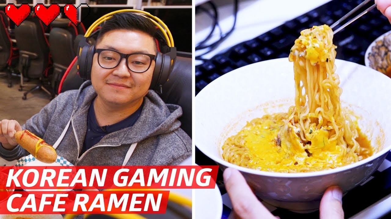 A bowl of upgraded Korean PC bang ramyeon with egg cheese and toppings served at a gaming cafe counter ready to be delivered to a seat