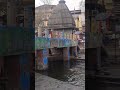 Shirtless Men Bathing In River