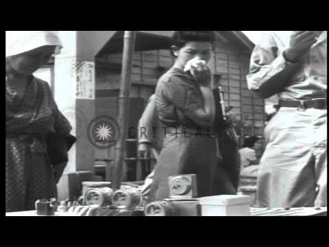 US soldiers and Japanese civilians in Tokyo, Japan, during American occupation af...HD Stock Footage