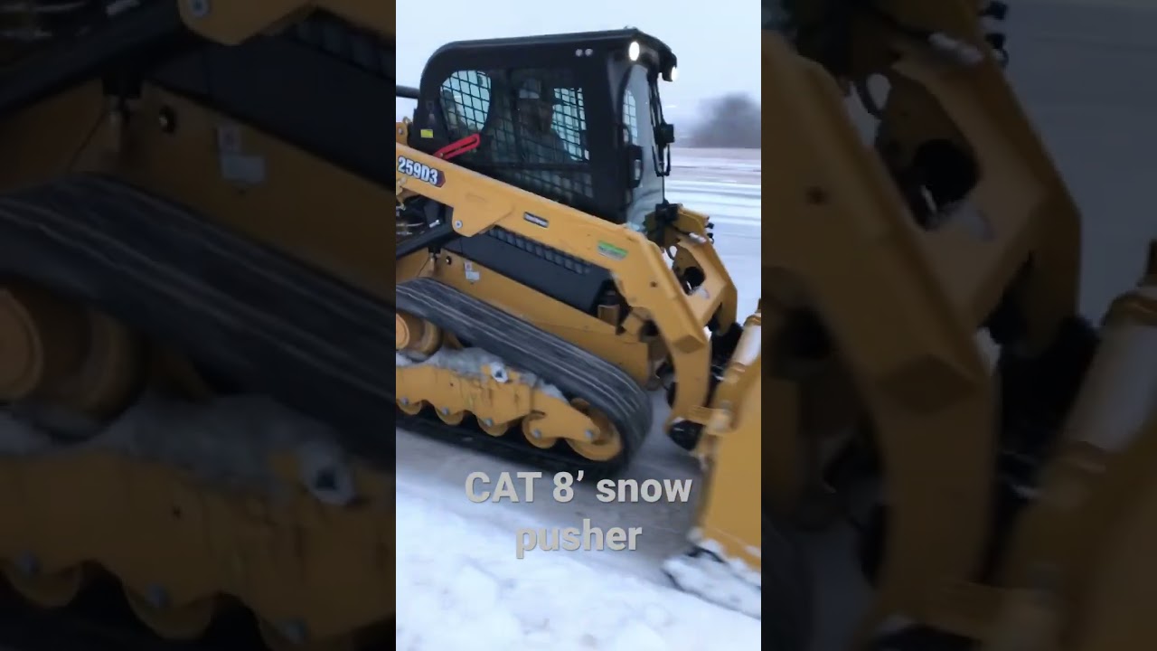 CAT 259D3 pushing sleet & snow