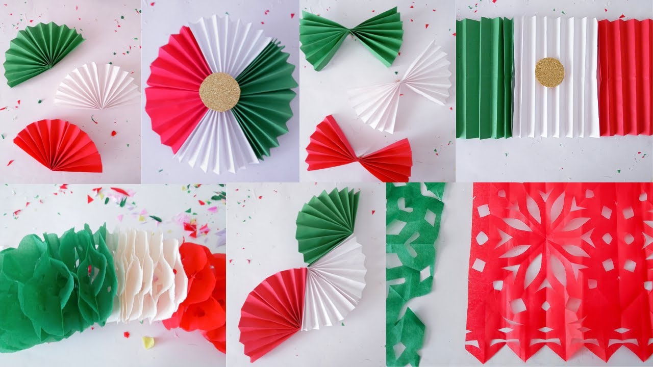 Mexican papel picado, garlands and tricolor decorations made with tissue paper, crepe paper and b...