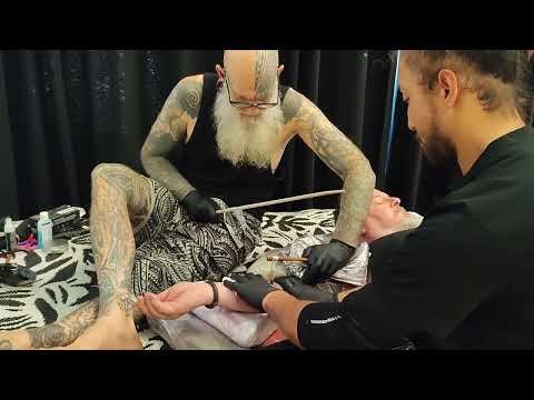 Traditional Māori tattoo style (tattooing hand)