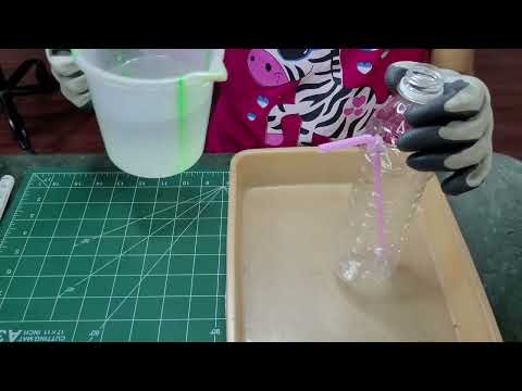 Part of a video titled How to make water dispenser using plastic bottles - YouTube