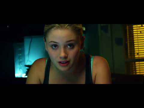 Handheld night shot: tail-lights smear as a moody pop cue takes over