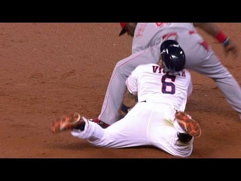 Villar slides into Phillips' backside