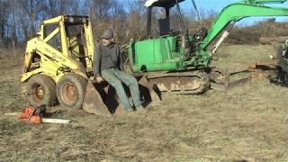 Piling Brush using an Excavator and a Skid Steer