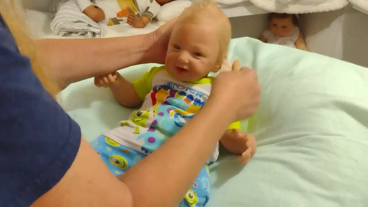 Changing a funny little guy into comfy pj's