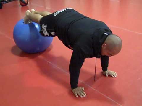 Decline push ups on stability ball