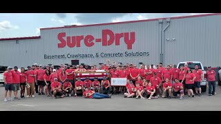 Watch video: Sure-Dry Employees Build 52 Beds for Sleep...