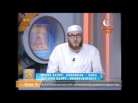 Can we recite from the Quran while holding it in prayer | Dr Muhammad Salah