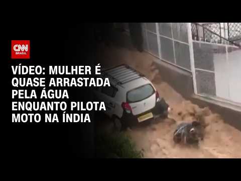 Mulher é quase arrastada pela água enquanto pilota moto na Índia; confira vídeo | CNN BRASIL