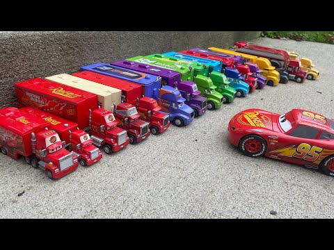 Lightning McQueen and other racers transport with Mack and haulers collection