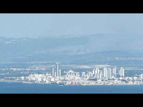 Smoke rises in northern Israel after dozens of rockets fired by Hezbollah | AFP