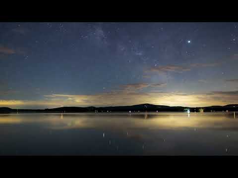 Videli Free Footage - Night sky with stars at a calm lake, time lapse